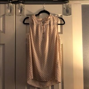 Pink and black polka dotted shell w gold accents.